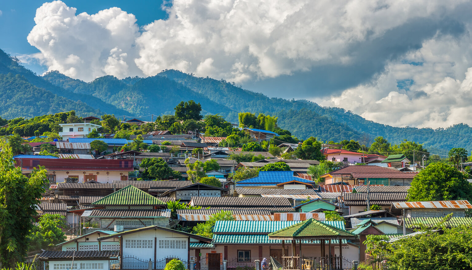 View of a mountainside with colourful houses.