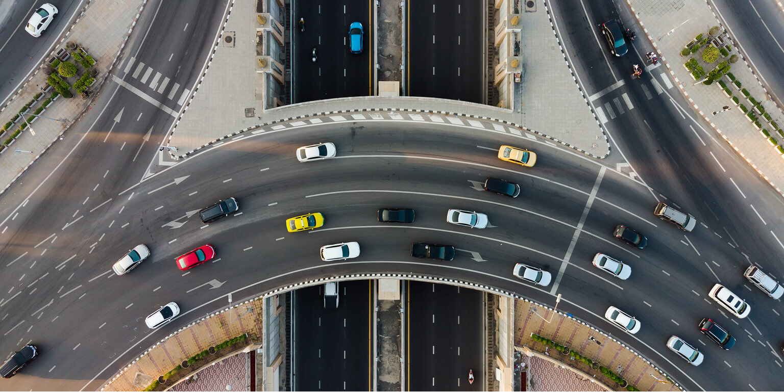 Birds eye view of a curved highway in Thailand.